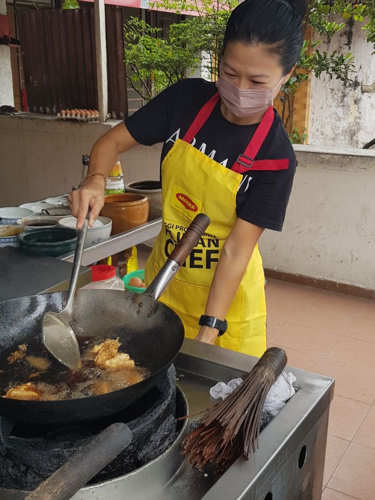 The Roads and Sites Less Travelled in Malacca - Cooking Chicken