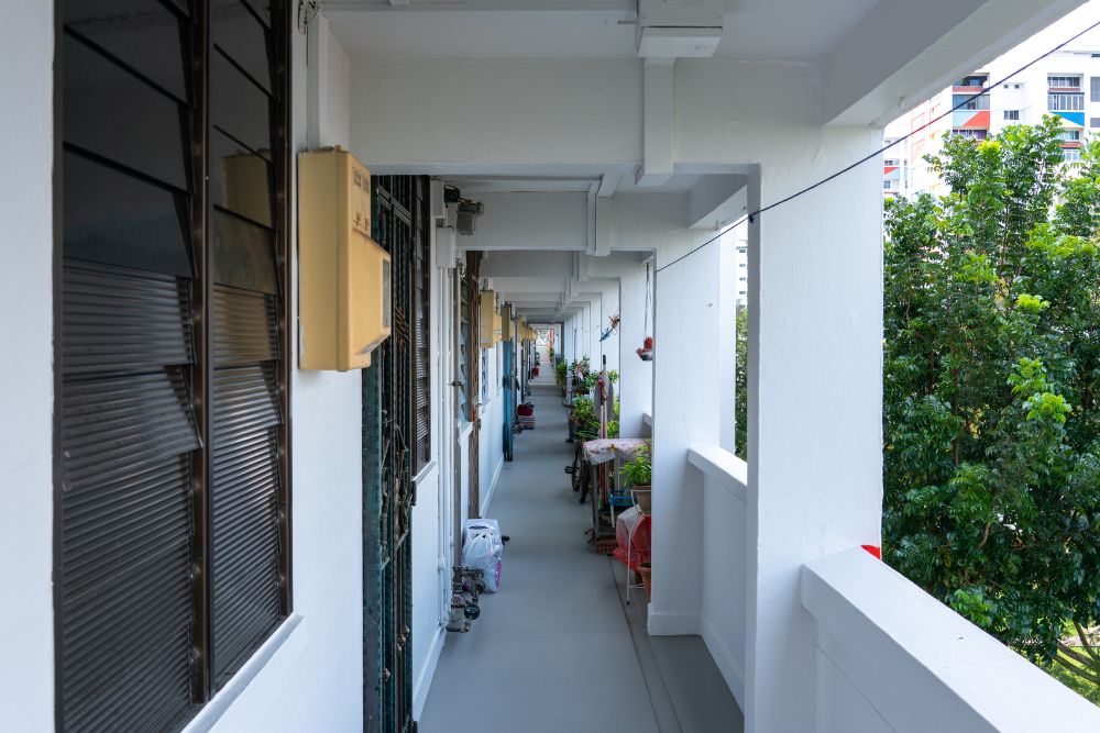 Dear Silvers: It’s Time To Part With Your Hoard Of Chilli Sauce Packets & Old Magazines - HDB Corridor