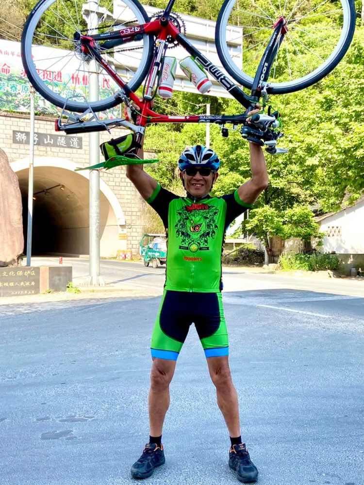 Cycling 60km A Day: The Silver Who Keeps On Riding, Even When Facing Lung Cancer And 31 Broken Bones Due to Osteoporosis - Joshua OHPs a bike