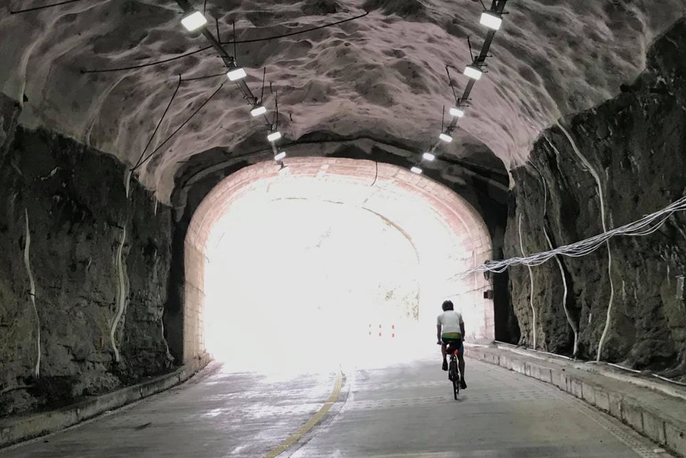 Cycling 60km A Day: The Silver Who Keeps On Riding, Even When Facing Lung Cancer And 31 Broken Bones Due to Osteoporosis - Joshua riding light at the end of the tunnel