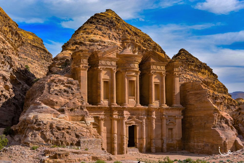 8 Realistic Bucket List Trips That Everyone Can Complete (And Afford!) - Visiting the historical city of Petra, Jordan