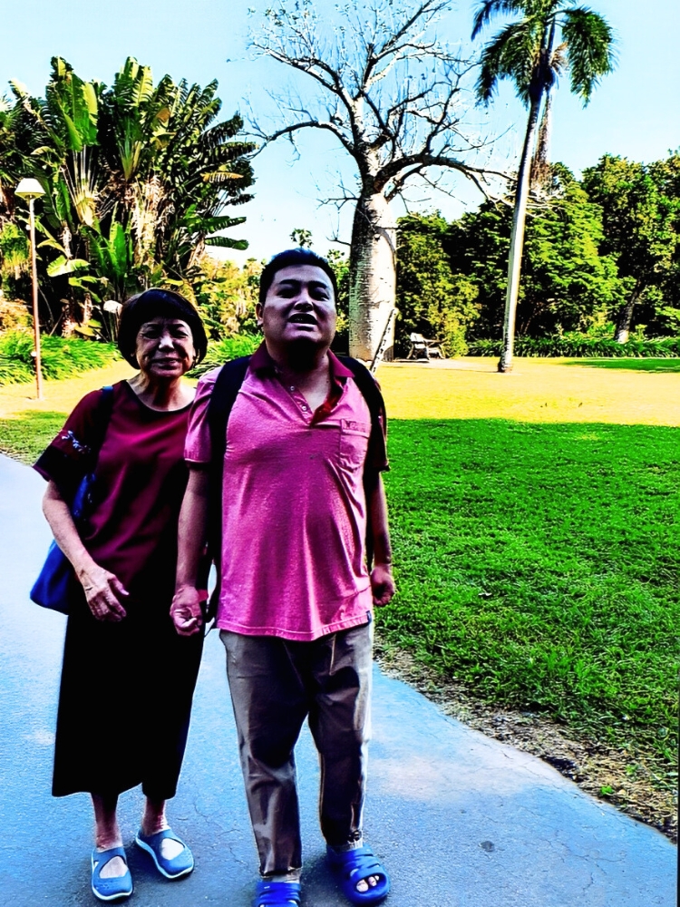 Caring For The Future of My Autistic Adult Child: This Mother’s Enduring Love And Plan - Susie and Zhao Xiong taking a short break at a resort in Johor Bahru in 2024