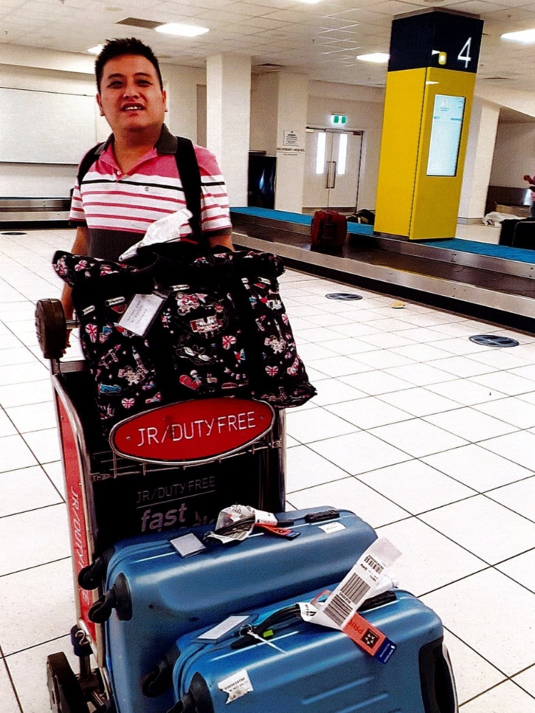Caring For The Future of My Autistic Adult Child: This Mother’s Enduring Love And Plan - Zhao Xiong travelling to Darwin, Australia in 2003 for a family holiday.