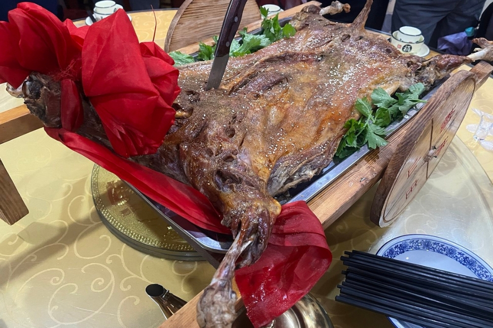 Discovering China's Silk Road in 2025: Ancient History, High Speed Trains, and Spectacular Shows - Roasted lamb in Dunhuang