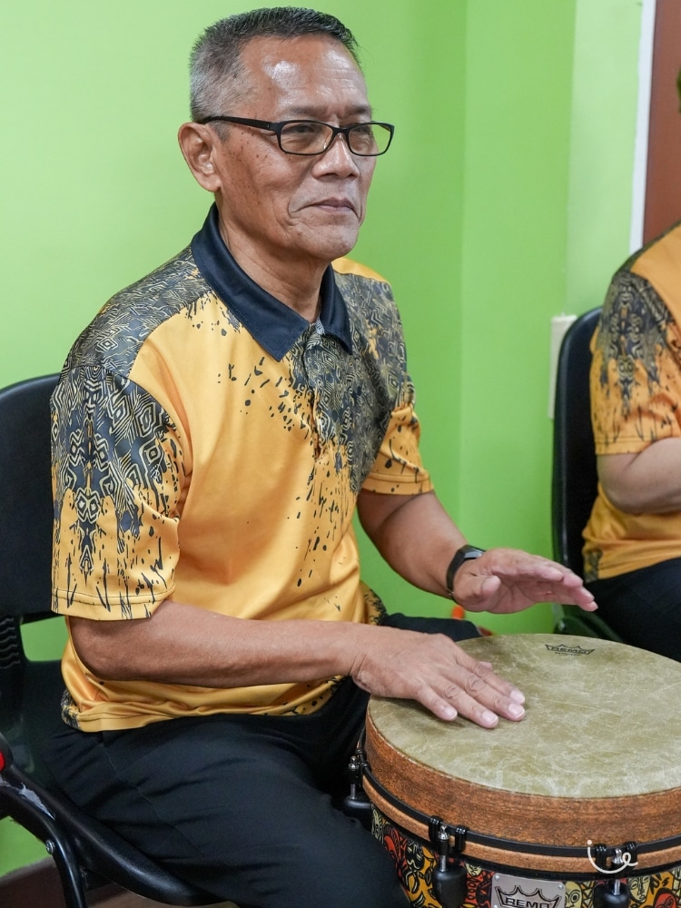 Never Too Old To Drum: The Tampines Seniors Keeping Mind And Body Active - Ramli Bin Selamat playing the djembe