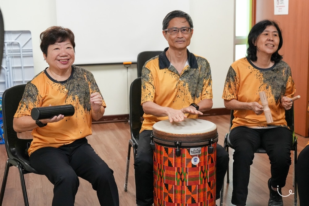 Never Too Old To Drum: The Tampines Seniors Keeping Mind And Body Active - Yeo Djeng Piaw playing the tubano. His wife, Lim Sok Hoon, is on his left