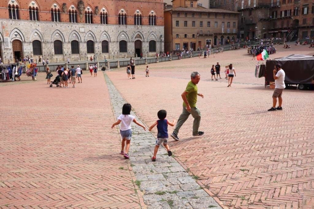 The Joy Of Slow Travel: How My Travel Style Changed With Age - Granddad playing with Grandkids