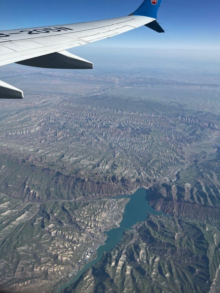 Journey Through Xinjiang: Exploring The Silk Road’s Revival, Ancient Cities, and China’s Stunning Landscapes - Plane window Kashgar view