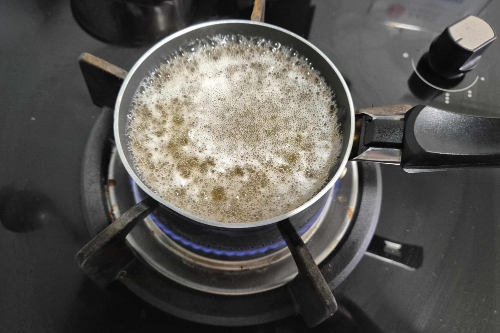 Leftover Beer: How To Turn It Into Homemade Skincare Products And Cleaning Agents - Degassing beer over a stove